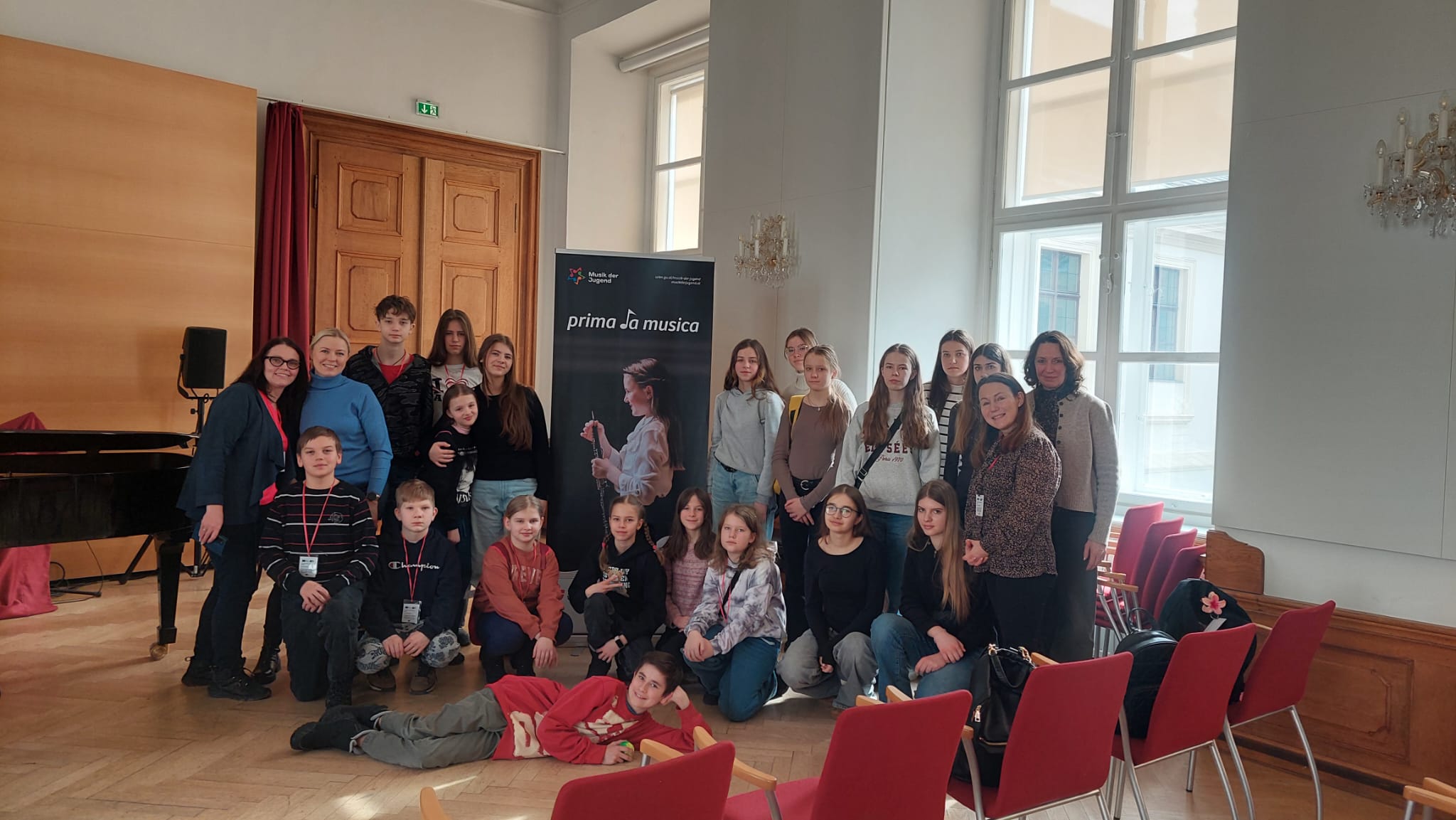 Students proudly displaying their certificates of completion